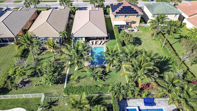 birds eye view of property with a residential view