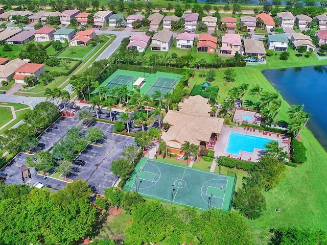 birds eye view of property with a residential view and a water view