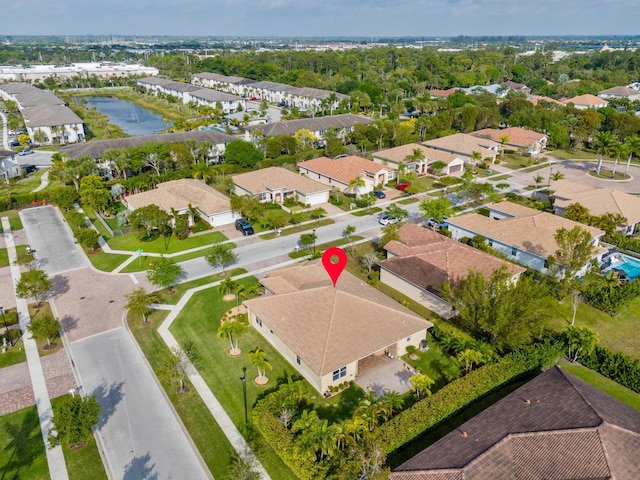 aerial view with a residential view and a water view