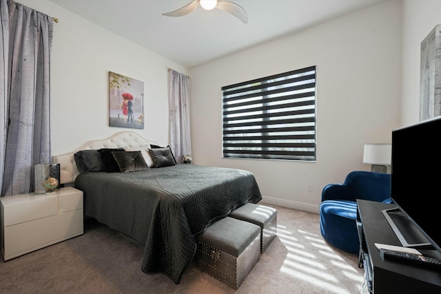 bedroom with carpet, baseboards, and ceiling fan