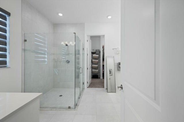 full bath featuring recessed lighting, a shower stall, vanity, and tile patterned floors