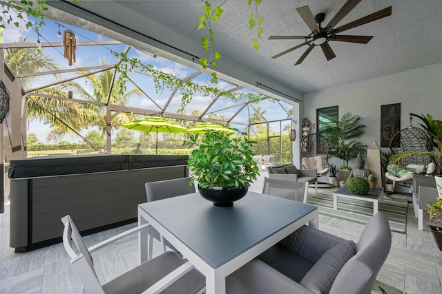 sunroom with ceiling fan