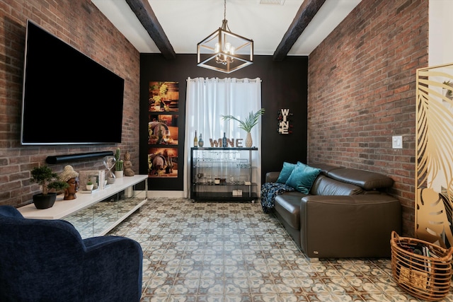 living area featuring a large fireplace, brick wall, visible vents, and beam ceiling