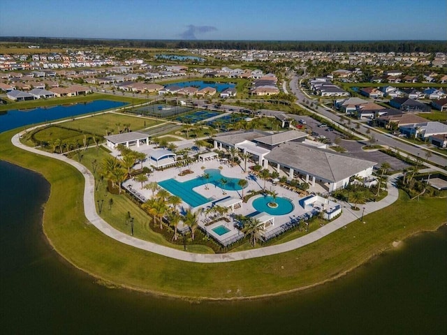 birds eye view of property featuring a residential view and a water view