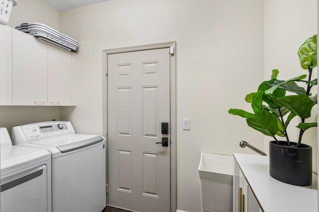 laundry room featuring cabinet space and washer and clothes dryer