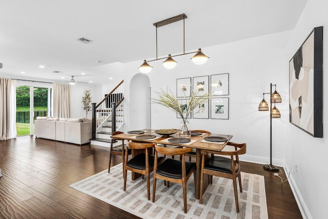 dining space with visible vents and dark wood finished floors