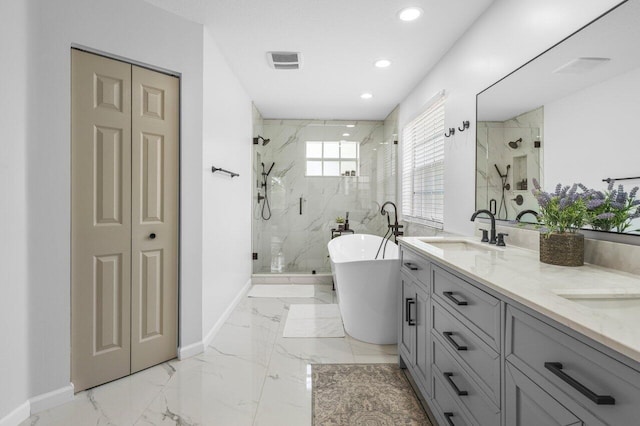 bathroom featuring visible vents, marble finish floor, baseboards, and a sink