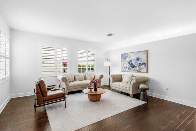 dining room with baseboards, wood-type flooring, and visible vents