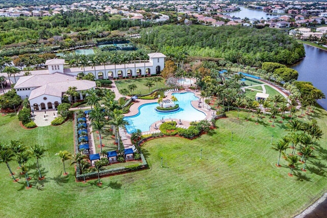 birds eye view of property with a water view