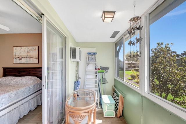 sunroom with a wall unit AC