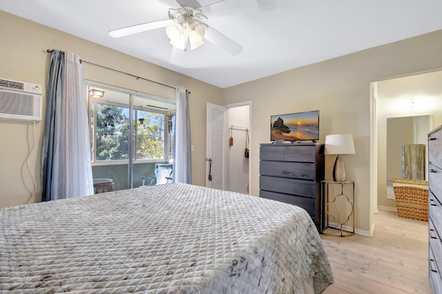 bedroom with baseboards, a ceiling fan, a wall unit AC, access to outside, and light wood-type flooring