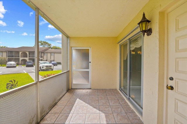 unfurnished sunroom with a residential view