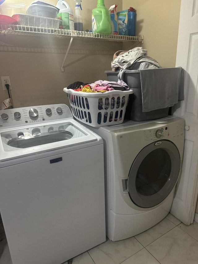 laundry room featuring washer and dryer and laundry area