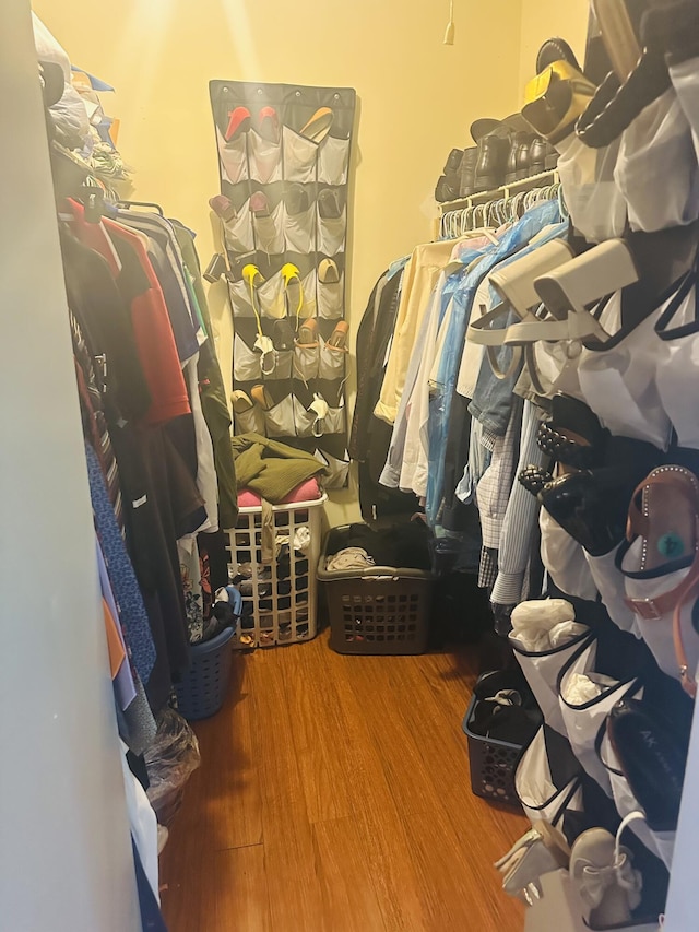 spacious closet with wood finished floors