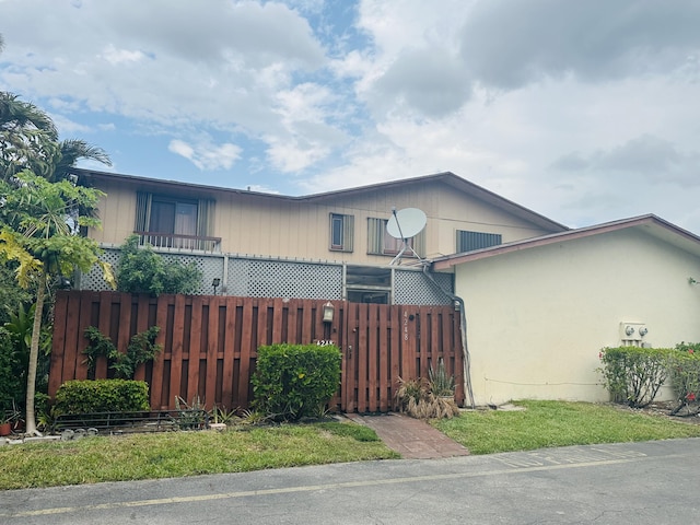 view of front of house with fence