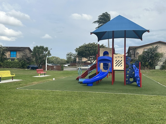 community jungle gym with a yard