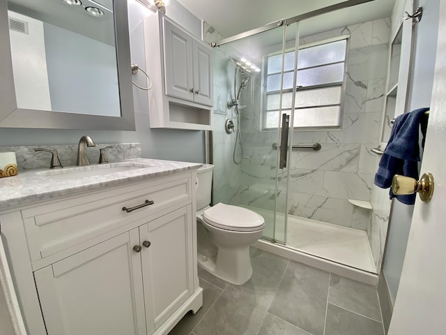 full bath featuring visible vents, toilet, vanity, and a marble finish shower