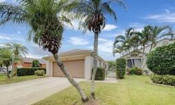 view of front of property with a front yard, a garage, and driveway