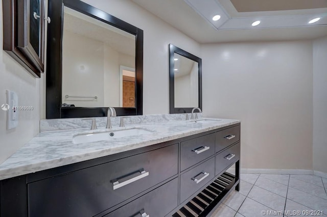 full bathroom featuring double vanity, recessed lighting, and a sink