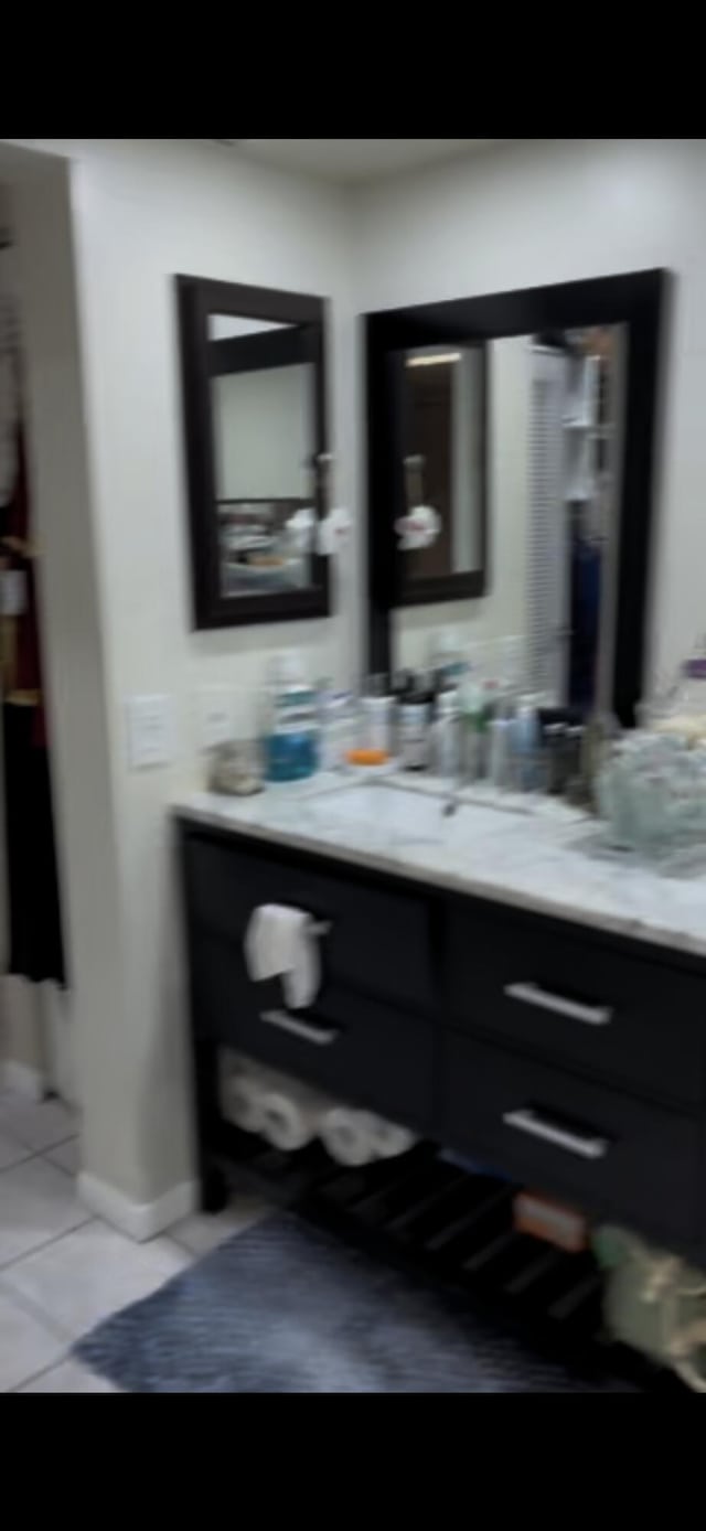 bathroom with tile patterned floors