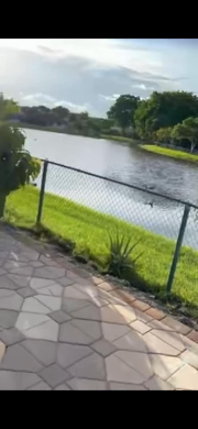 view of water feature featuring fence