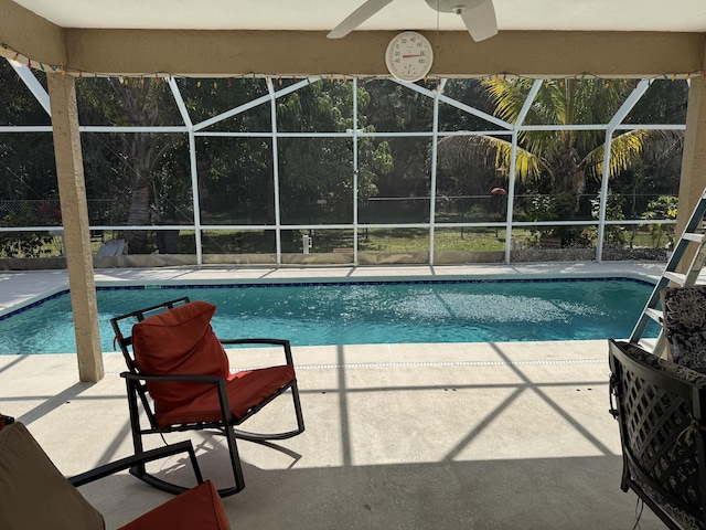 pool featuring a lanai and a patio