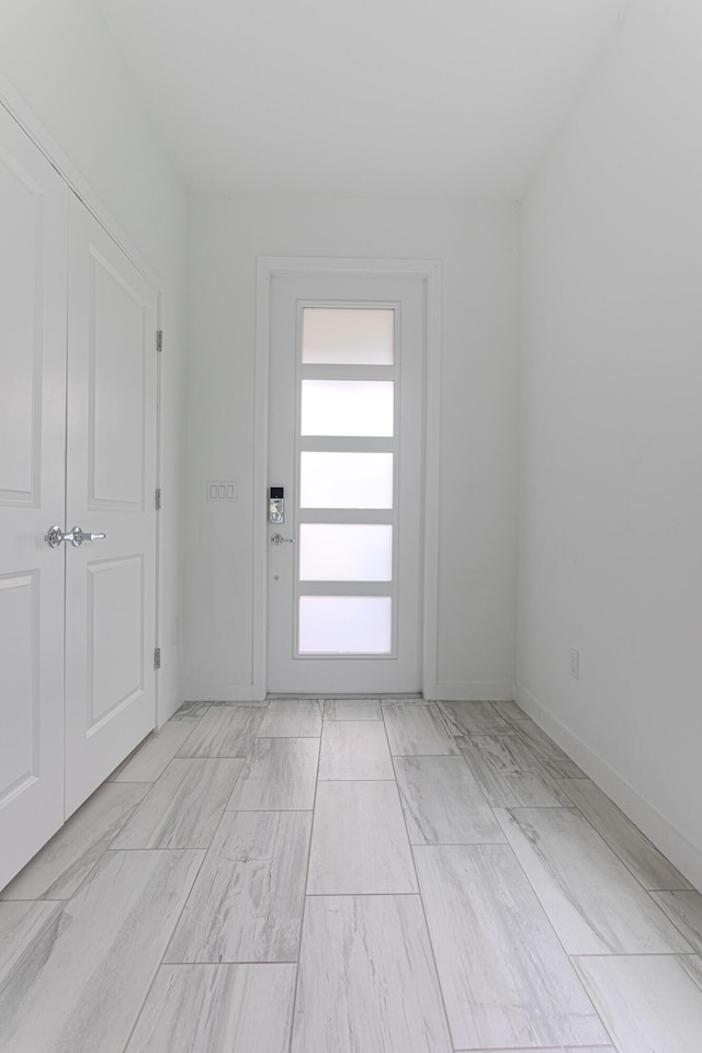 interior space featuring baseboards