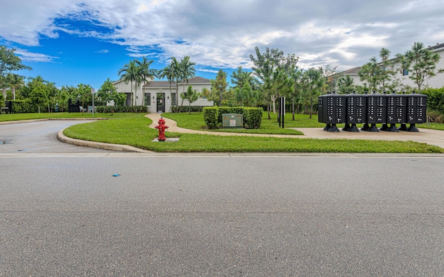 view of front of home featuring a front lawn and stucco siding