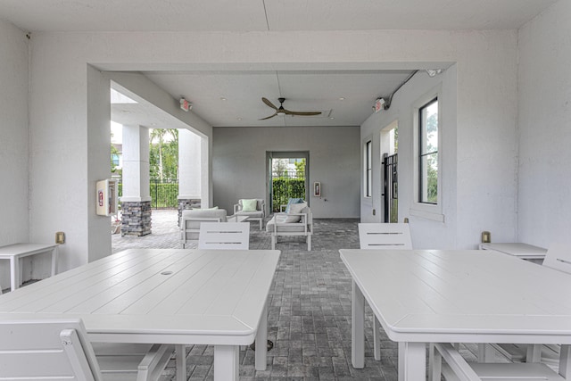 view of patio / terrace featuring ceiling fan and an outdoor living space