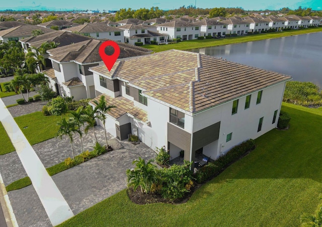 birds eye view of property featuring a residential view and a water view