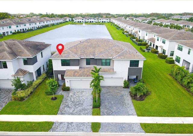 bird's eye view with a residential view and a water view