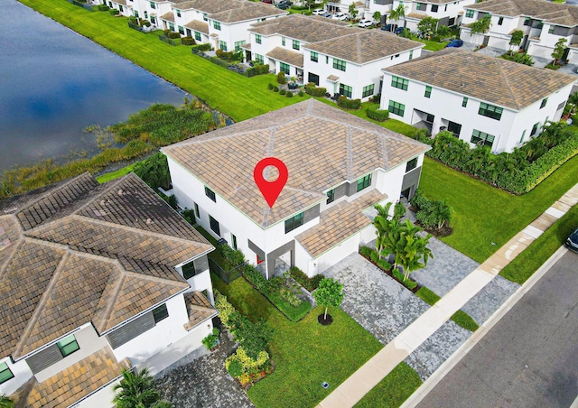 aerial view with a residential view and a water view