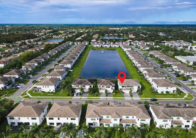 bird's eye view with a water view and a residential view