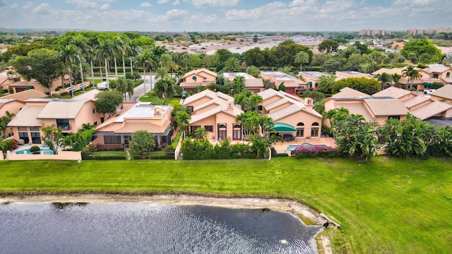 birds eye view of property with a residential view and a water view