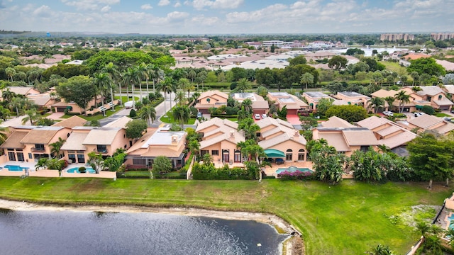 bird's eye view featuring a residential view and a water view