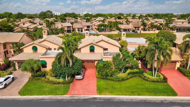 birds eye view of property with a residential view
