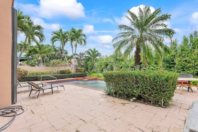 pool featuring a patio area