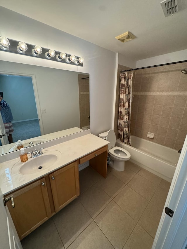 full bath with tile patterned floors, visible vents, vanity, and shower / tub combo