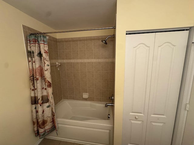 bathroom featuring tile patterned floors and shower / bathtub combination with curtain