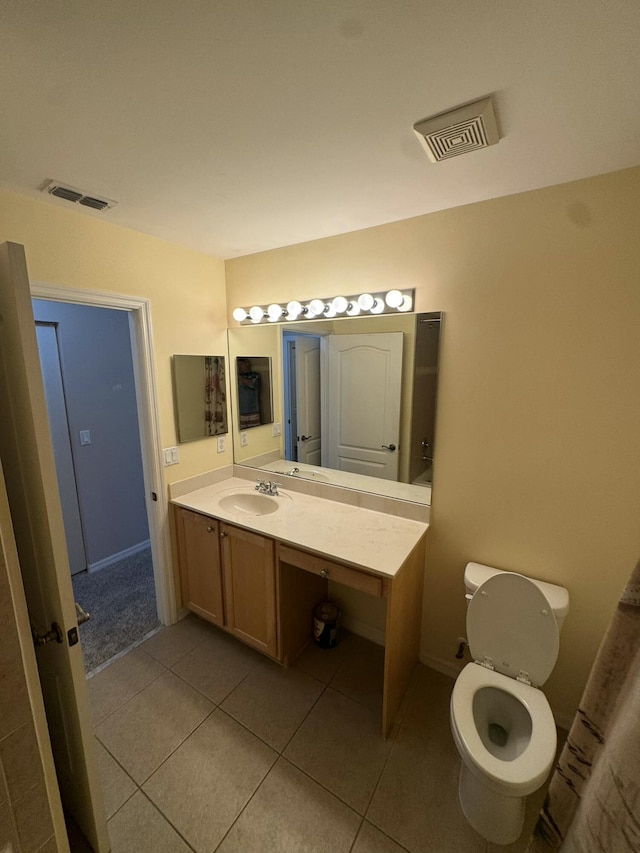 bathroom featuring tile patterned floors, visible vents, toilet, and vanity