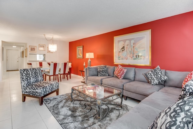 living area with light tile patterned floors and a textured ceiling