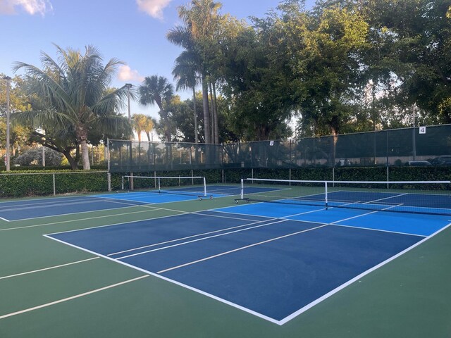 view of tennis court with fence