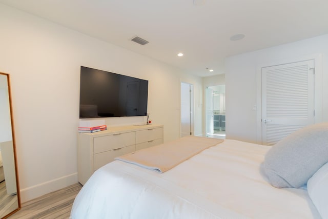 bedroom with recessed lighting, light wood-style floors, visible vents, and baseboards