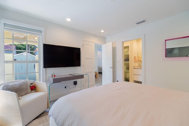 bedroom with recessed lighting and visible vents