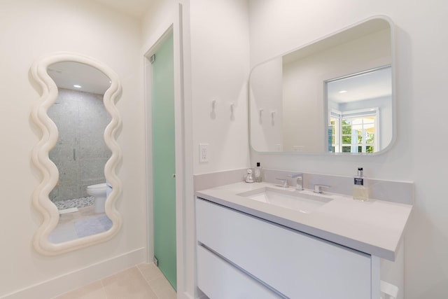 bathroom featuring tile patterned flooring and vanity