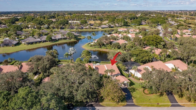 drone / aerial view featuring a residential view and a water view