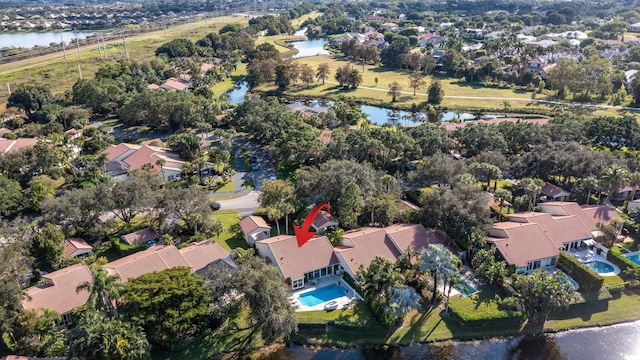 drone / aerial view featuring a residential view and a water view