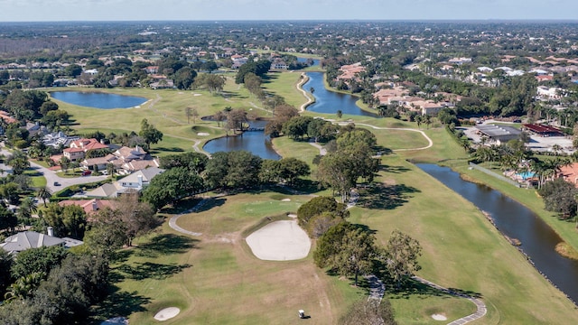 aerial view with a residential view, golf course view, and a water view