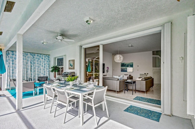 view of patio / terrace with an outdoor living space, outdoor dining area, and a ceiling fan