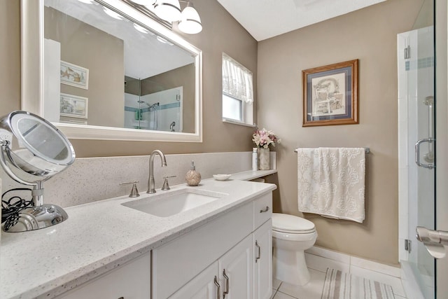 bathroom with toilet, a stall shower, vanity, and tile patterned floors